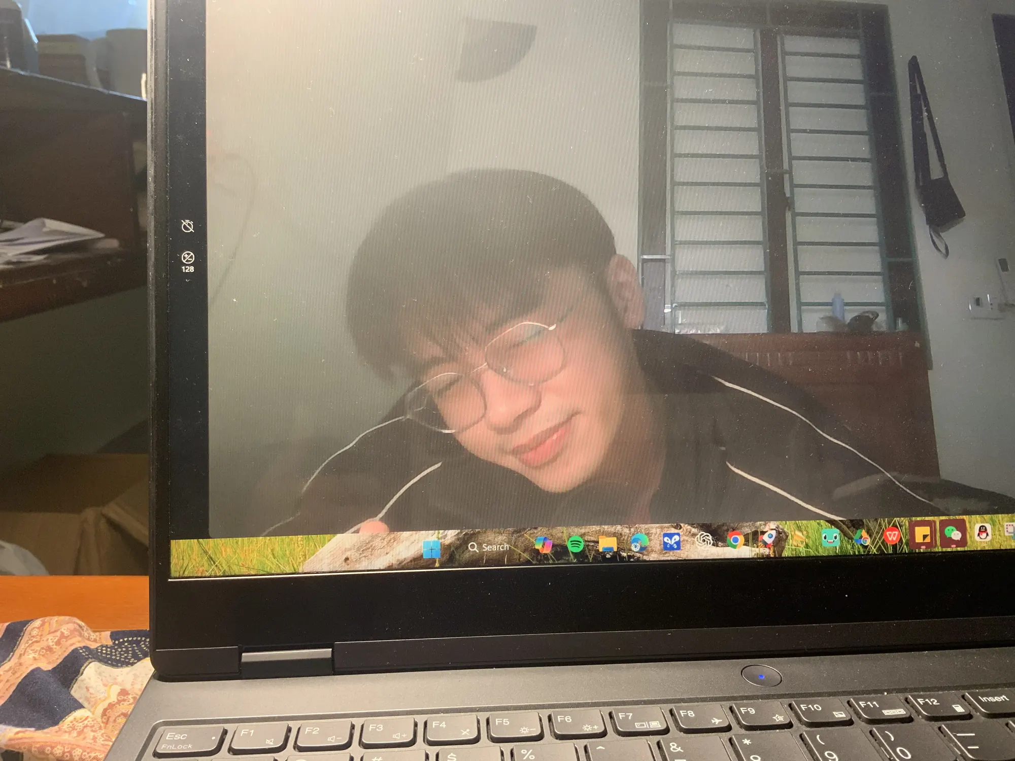 Hung working on his laptop at night