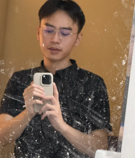 Mirror selfie in a dark shirt