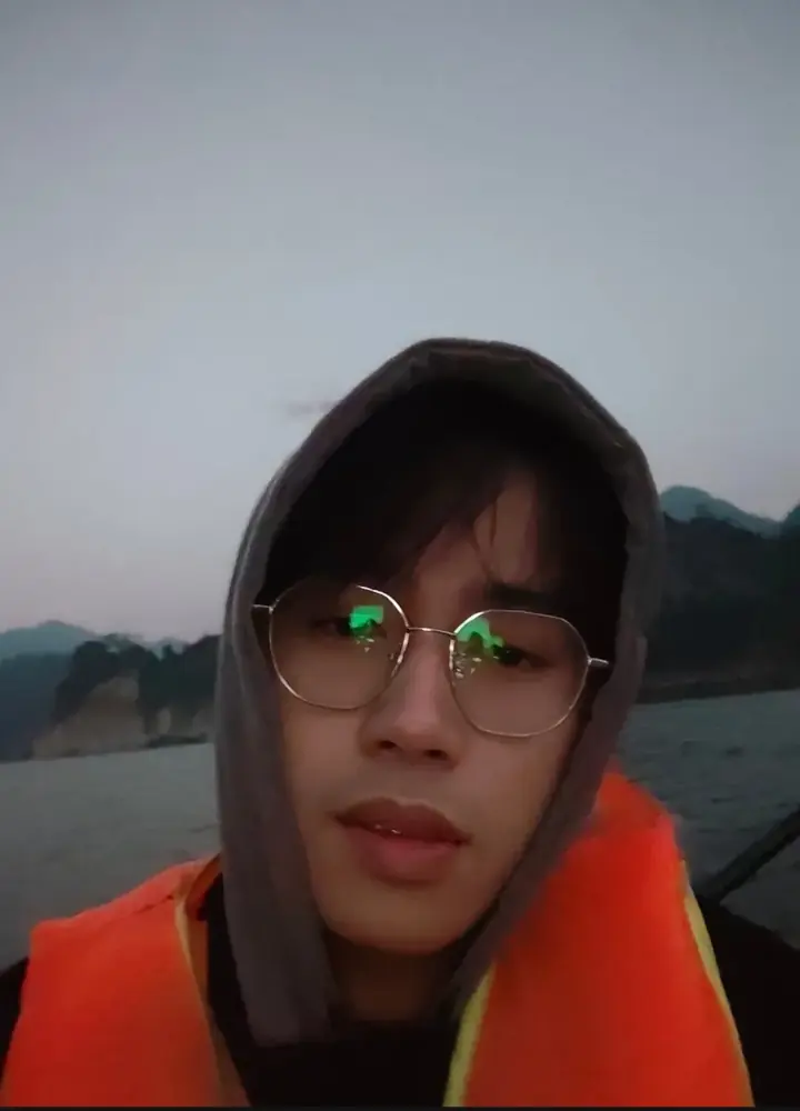 Hung on a boat at dusk in a life jacket